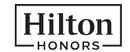 Hilton Honors merklogo voor beoordelingen van reis- en vakantie-ervaringen